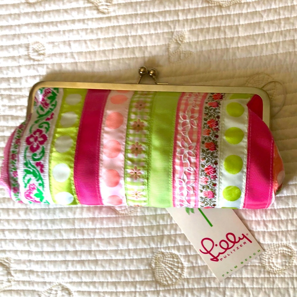 Lilly Pulitzer clutch. Colorful ribbon bands with pink solid lining.